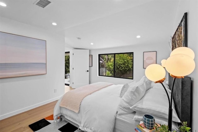 bedroom with light wood-type flooring