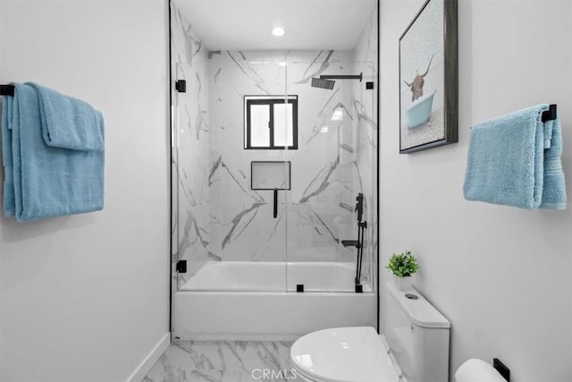 bathroom featuring toilet and combined bath / shower with glass door