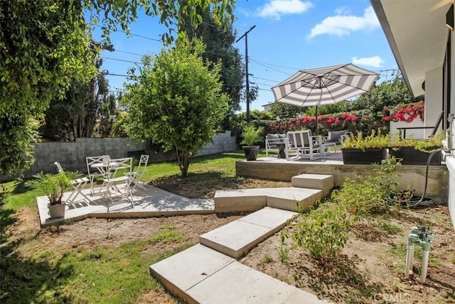 view of community with a patio