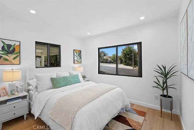 bedroom with light wood-type flooring