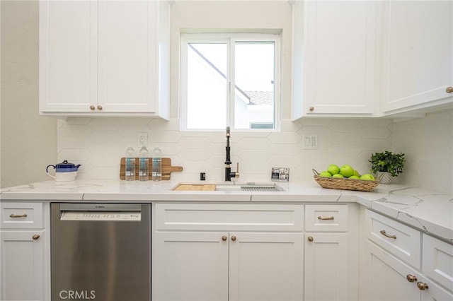 kitchen with white cabinetry, tasteful backsplash, dishwasher, light stone counters, and sink