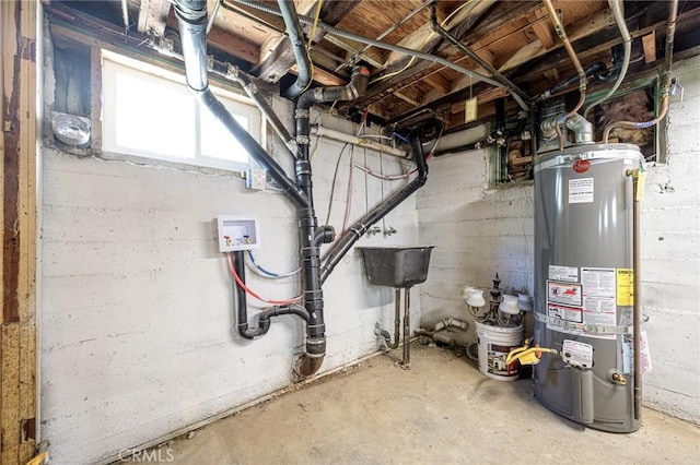 utilities with sink and gas water heater