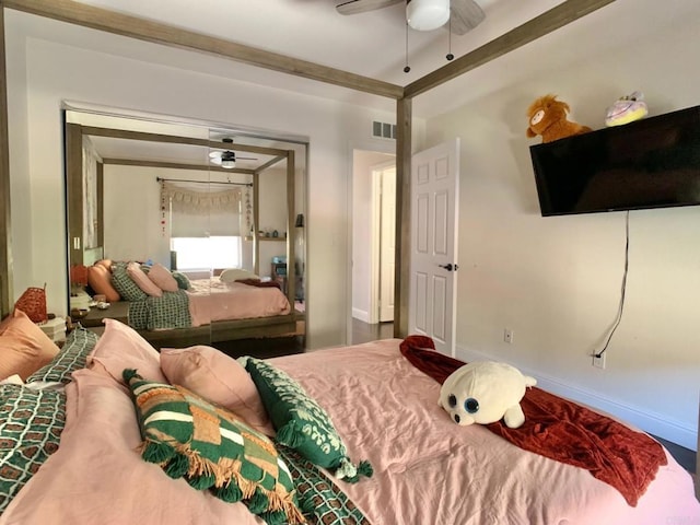 bedroom with ceiling fan and a closet