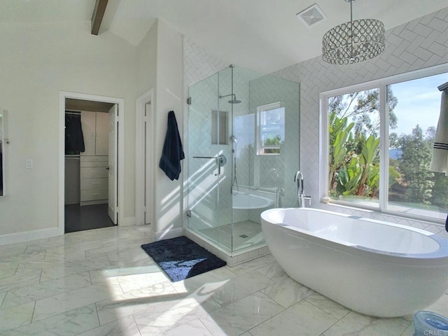 bathroom featuring lofted ceiling with beams, a wealth of natural light, an inviting chandelier, and shower with separate bathtub