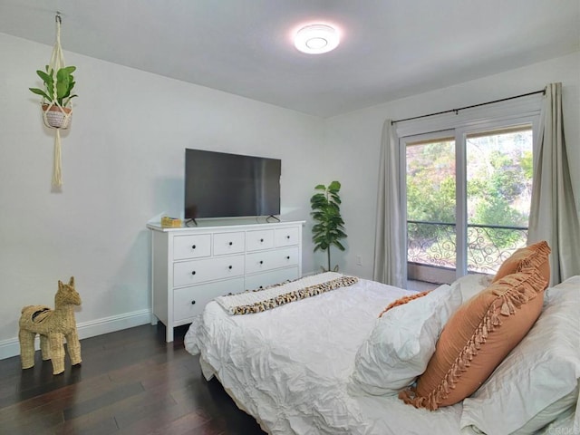 bedroom with dark hardwood / wood-style flooring