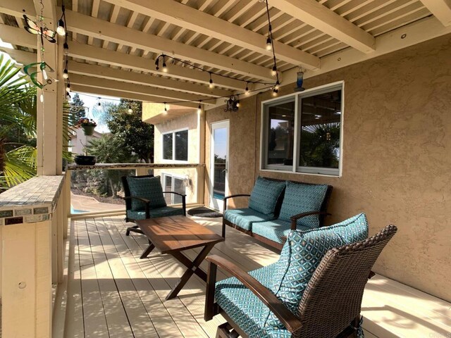 wooden deck featuring an outdoor living space