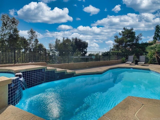 view of pool with pool water feature