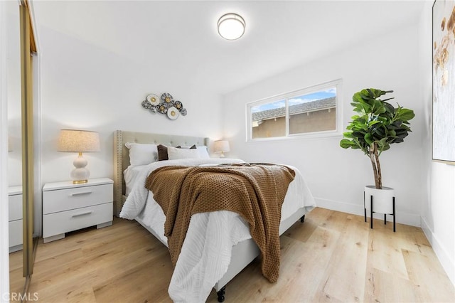 bedroom with light wood-type flooring