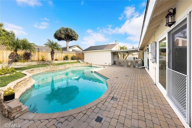 view of swimming pool featuring a patio