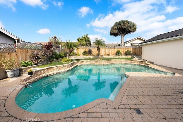 view of swimming pool featuring a patio area