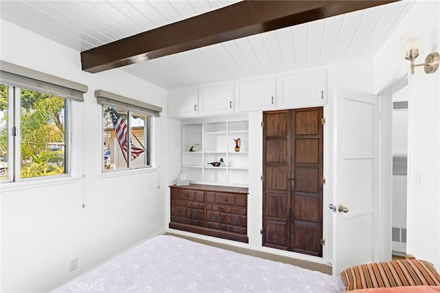 bedroom with beam ceiling and wooden ceiling