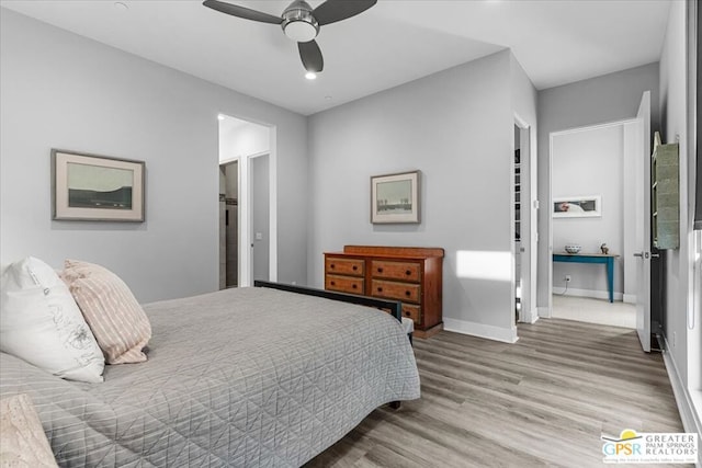 bedroom with ceiling fan and hardwood / wood-style flooring