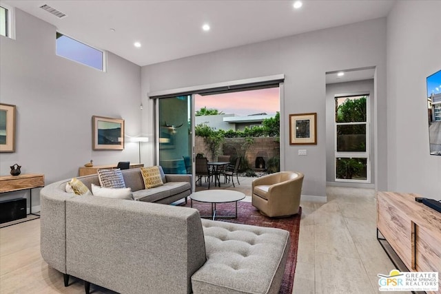 living room featuring a healthy amount of sunlight and light wood-type flooring