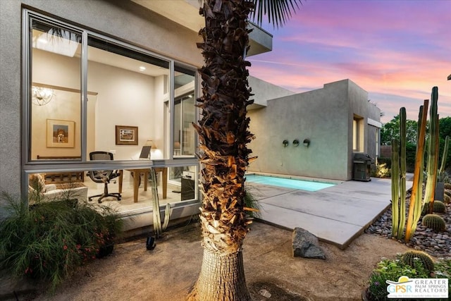 patio terrace at dusk with area for grilling