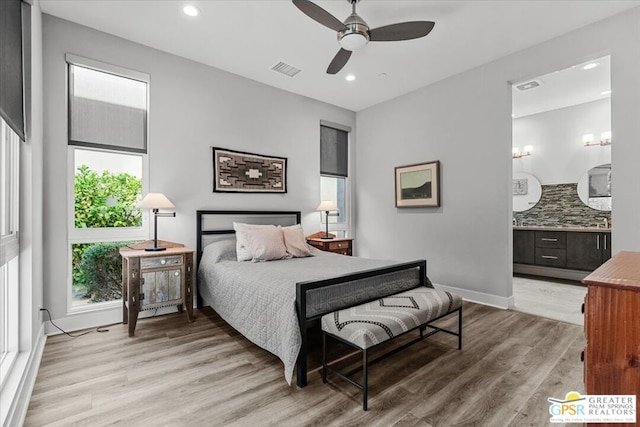 bedroom featuring ceiling fan and light hardwood / wood-style flooring