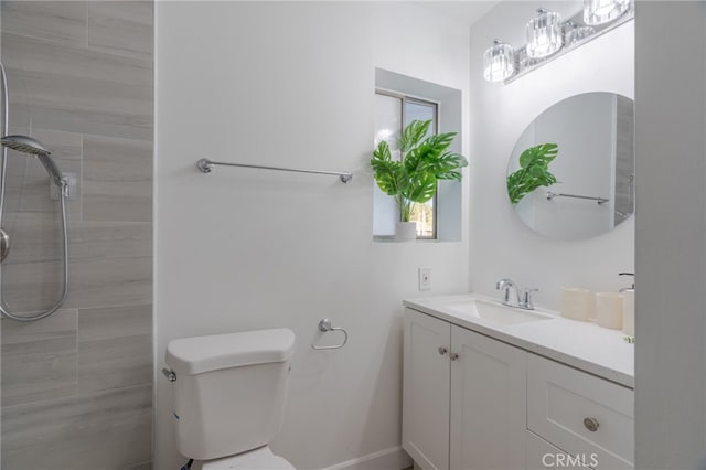 bathroom with toilet and vanity