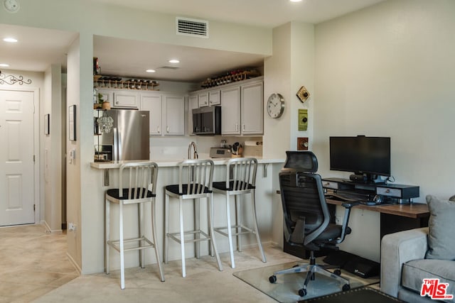 home office with light tile patterned floors