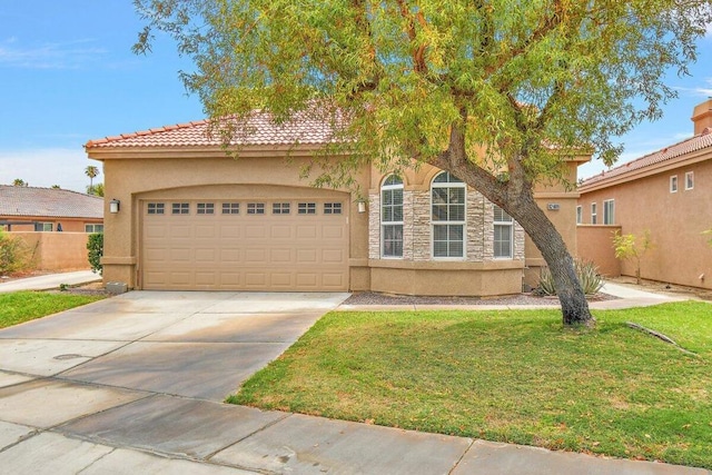 view of front of house featuring a garage and a front lawn