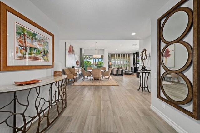 corridor featuring light hardwood / wood-style flooring