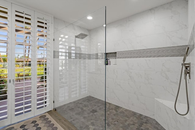 bathroom with a tile shower