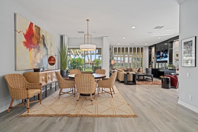 dining space featuring hardwood / wood-style floors