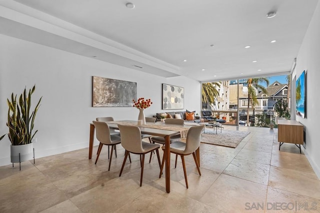 dining area with floor to ceiling windows