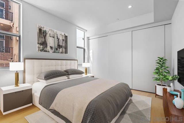 bedroom featuring a closet and light hardwood / wood-style floors