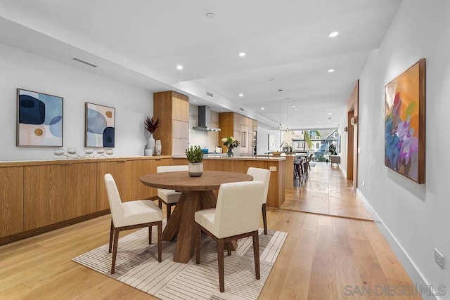 dining room featuring light hardwood / wood-style flooring