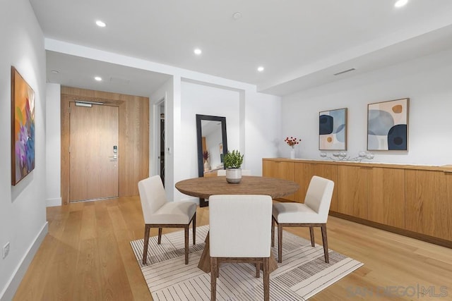 dining area with light hardwood / wood-style flooring