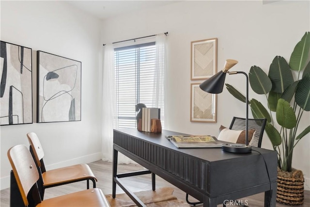 office with light wood-type flooring