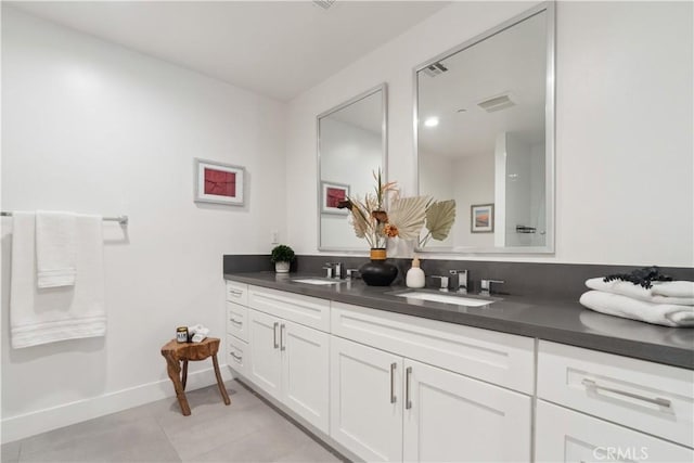 bathroom with tile patterned floors and vanity