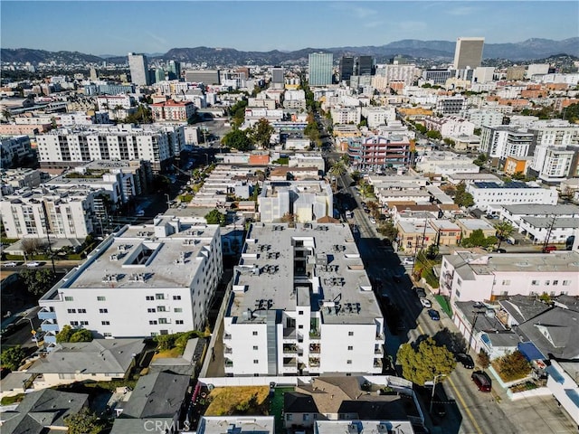 birds eye view of property featuring a mountain view