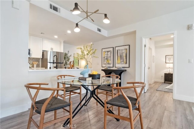 dining room featuring light wood-type flooring