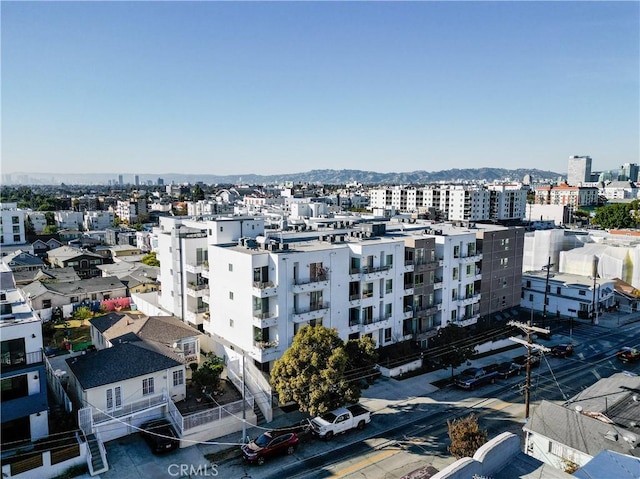 birds eye view of property featuring a mountain view