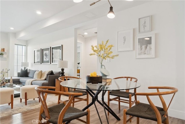 dining area with hardwood / wood-style flooring