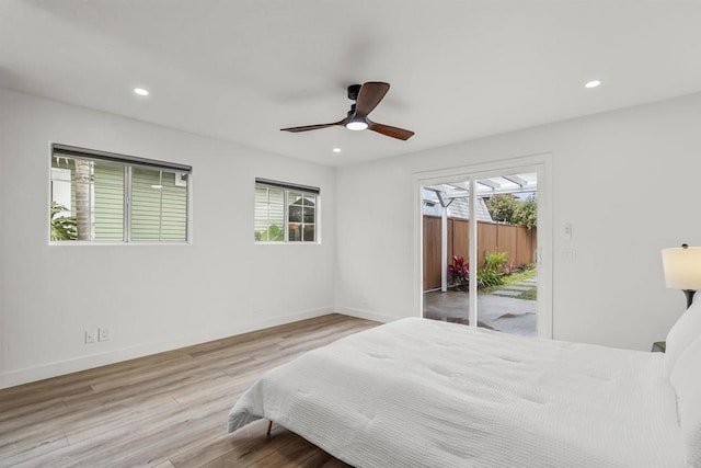 bedroom with access to outside, ceiling fan, and light hardwood / wood-style floors