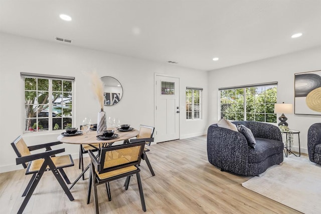 dining area with light hardwood / wood-style floors