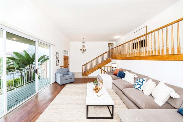 living room with an inviting chandelier and dark hardwood / wood-style floors