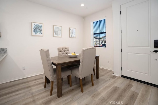 dining room with light hardwood / wood-style flooring