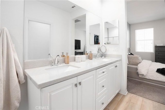 bathroom featuring vanity and wood-type flooring