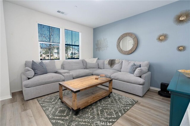 living room with light hardwood / wood-style flooring