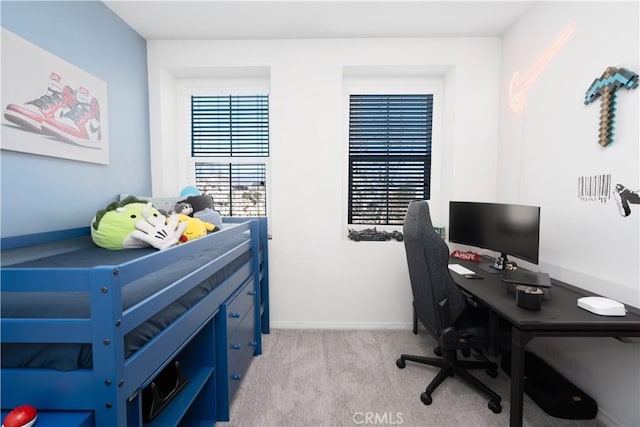 bedroom featuring light colored carpet