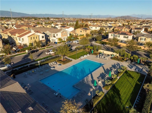 birds eye view of property with a mountain view