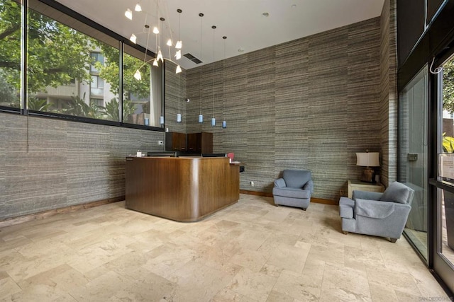 reception area featuring an inviting chandelier