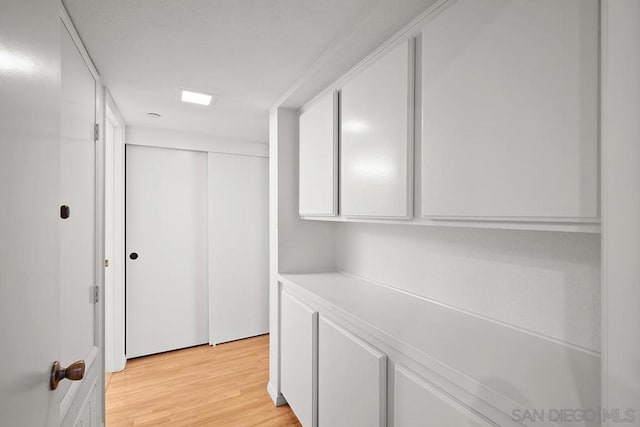 hallway featuring light wood-type flooring