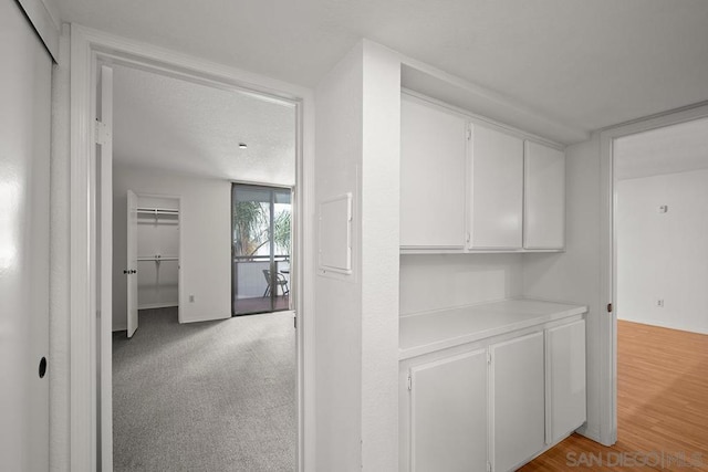 hallway with light wood-type flooring