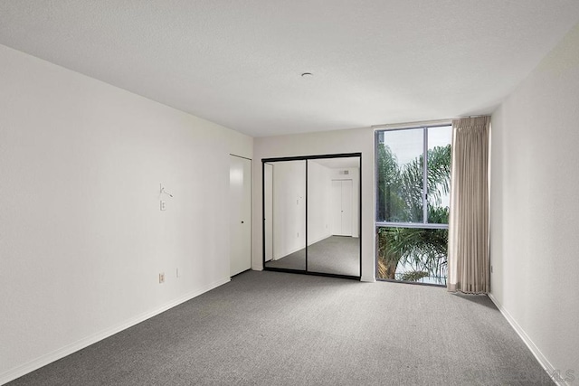 unfurnished bedroom with carpet flooring