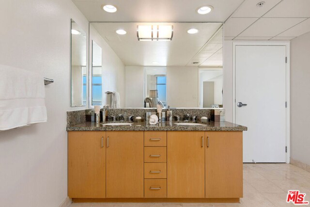 bathroom with vanity and tile patterned flooring