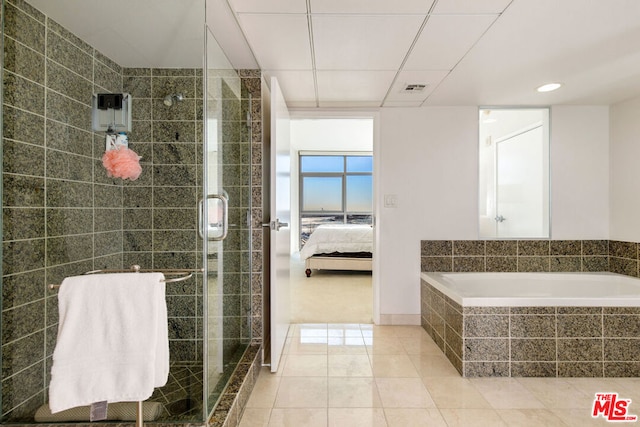 bathroom featuring tile patterned floors and plus walk in shower