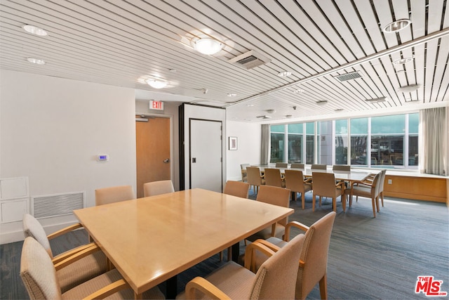 dining room featuring wooden ceiling